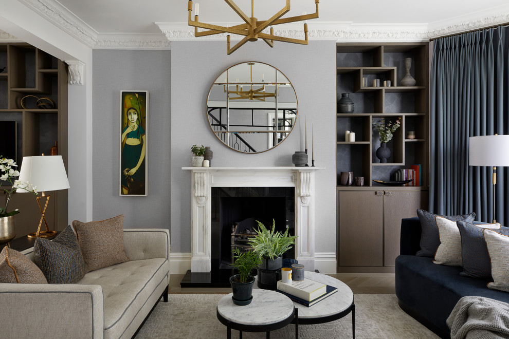 Inspiration for a classic living room with grey walls, medium hardwood flooring, a standard fireplace and brown floors.