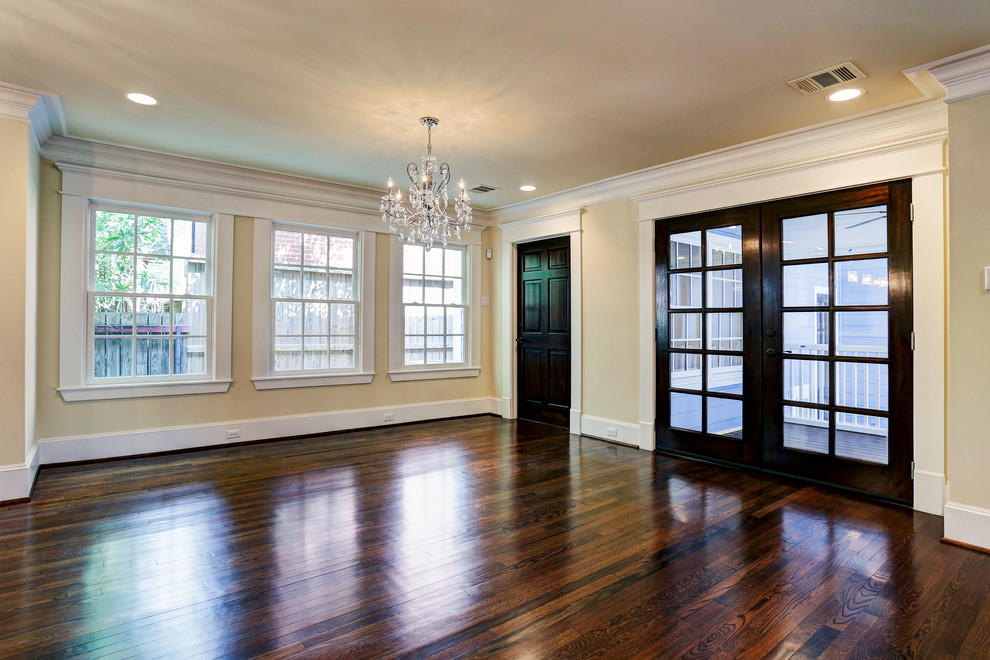 Large arts and crafts open plan dining in Houston with beige walls and medium hardwood floors.