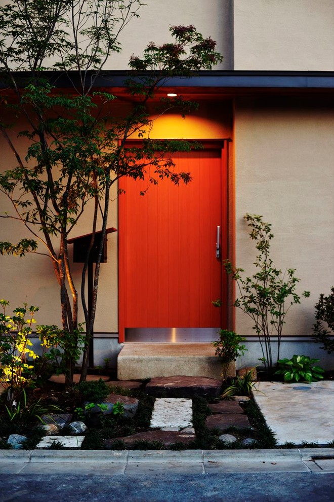 Design ideas for an asian front door in Tokyo Suburbs with a sliding front door.