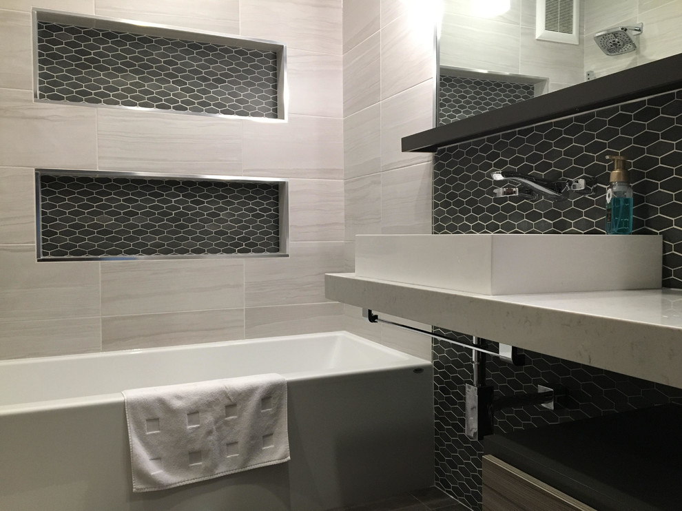 Design ideas for a mid-sized modern master bathroom in Other with dark wood cabinets, an alcove tub, a shower/bathtub combo, black and white tile, glass sheet wall, white walls, porcelain floors, a vessel sink, engineered quartz benchtops, open cabinets, black floor and an open shower.
