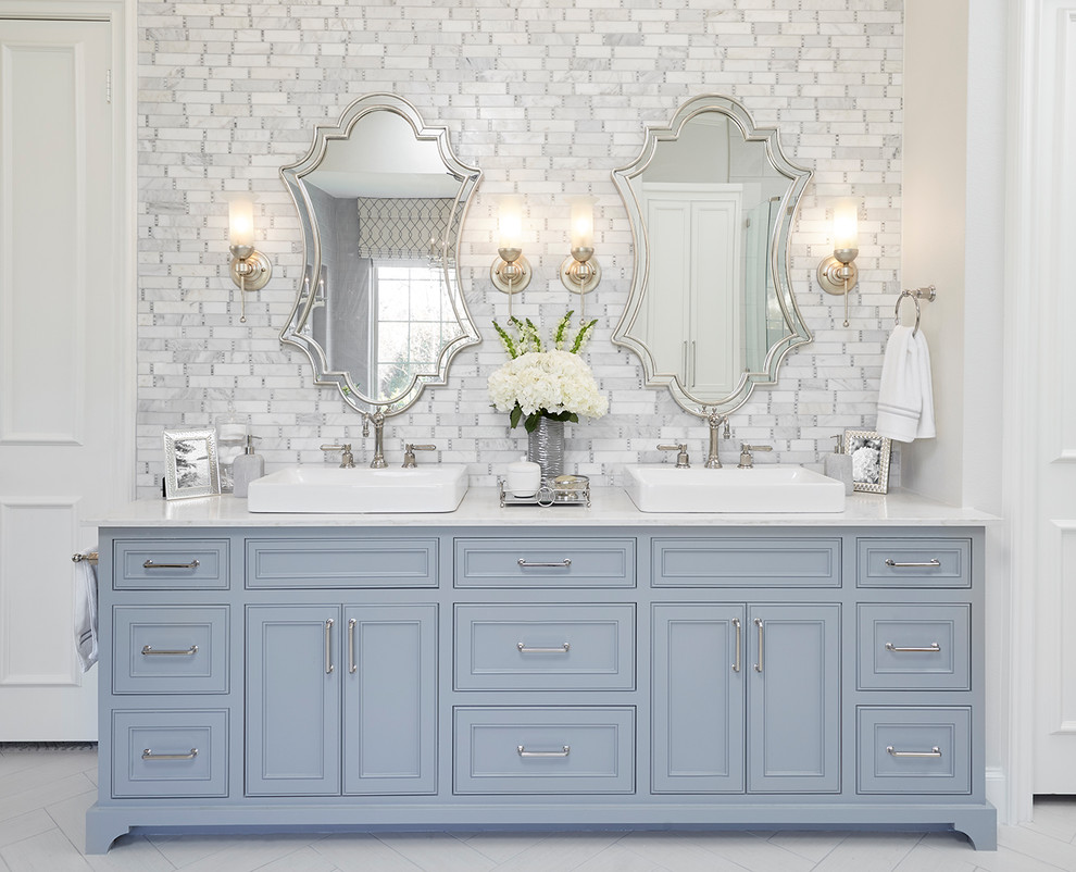 This is an example of a traditional master bathroom in Dallas with beaded inset cabinets, blue cabinets, white tile, gray tile, white walls, a vessel sink and white floor.