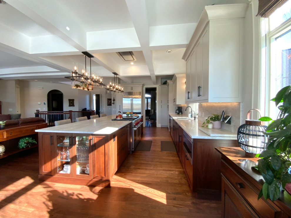 Eat-in kitchen - large transitional single-wall dark wood floor, brown floor and coffered ceiling eat-in kitchen idea in Calgary with shaker cabinets, gray cabinets, quartzite countertops, an island, white countertops, an undermount sink and stainless steel appliances