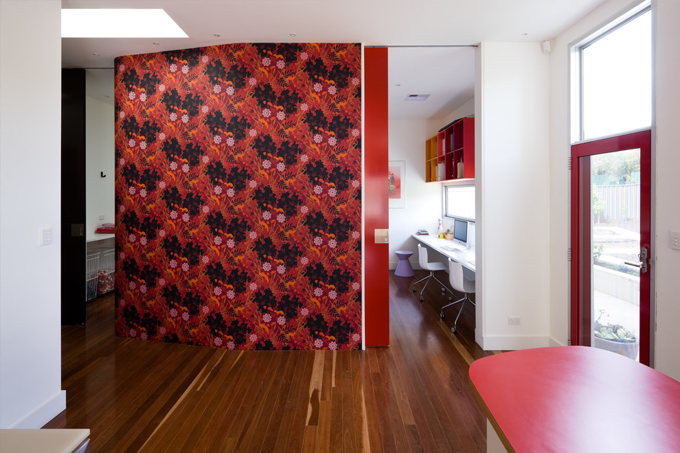 Contemporary home office in Adelaide with white walls and dark hardwood floors.