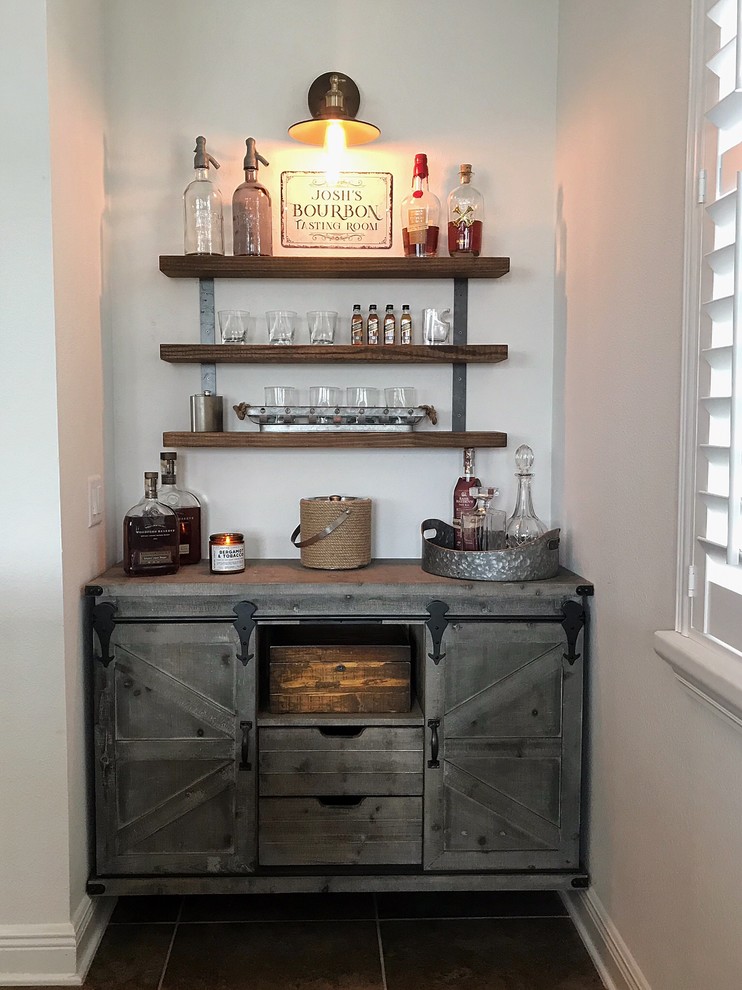 Design ideas for a small traditional single-wall bar cart in Tampa with distressed cabinets, stainless steel benchtops, white splashback, porcelain floors, brown floor and grey benchtop.