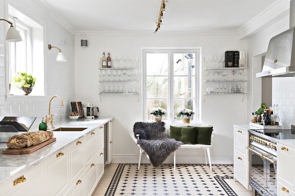 Design ideas for a traditional galley separate kitchen in Malmo with a single-bowl sink, white cabinets, white splashback, no island, multi-coloured floor, raised-panel cabinets, subway tile splashback and stainless steel appliances.