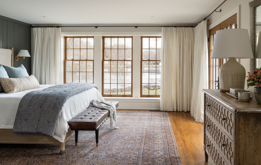 Example of a beach style master bedroom design in Boston