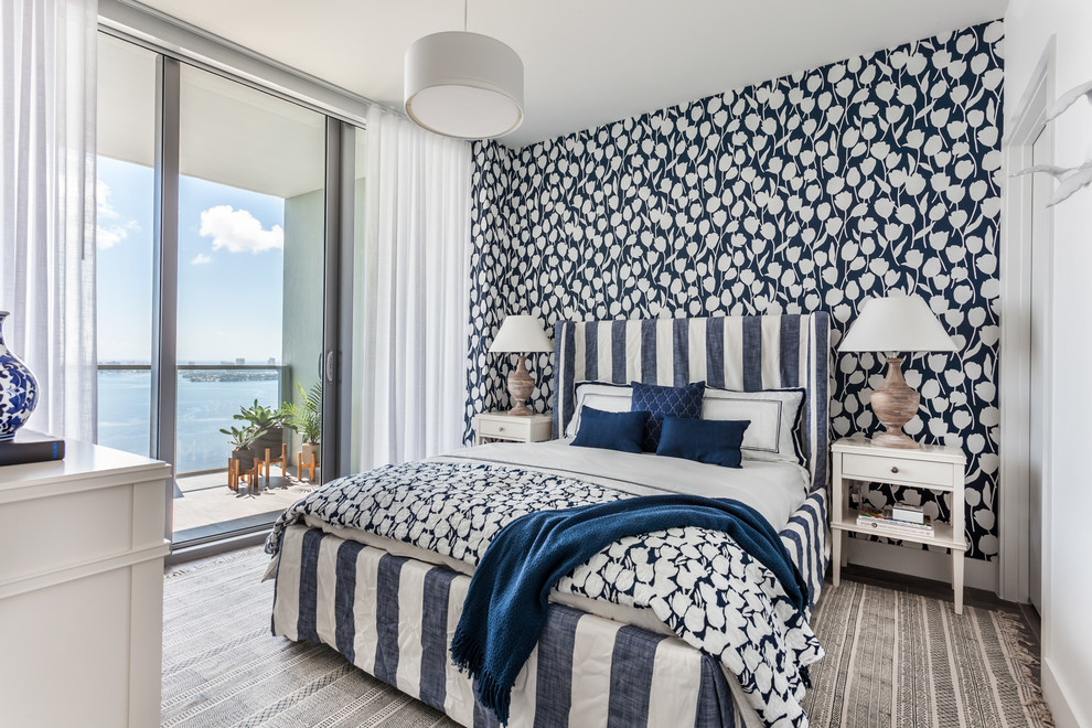 Mid-sized beach style guest bedroom in Miami with blue walls.