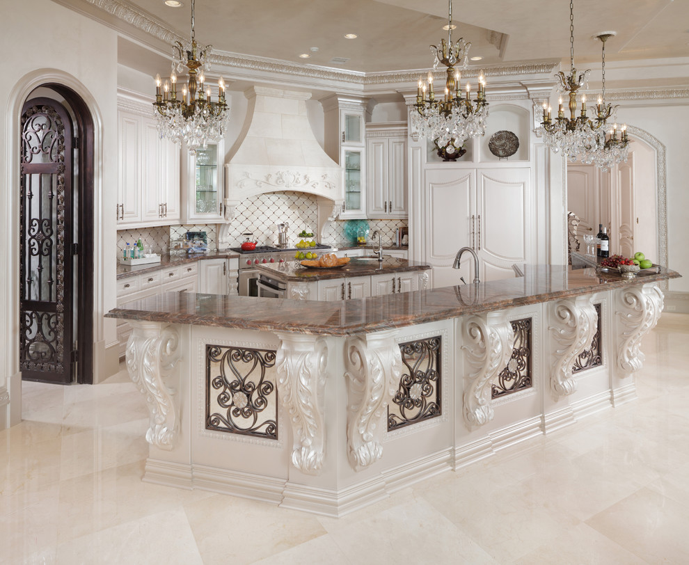 Inspiration for a mediterranean kitchen in Houston with white cabinets and panelled appliances.
