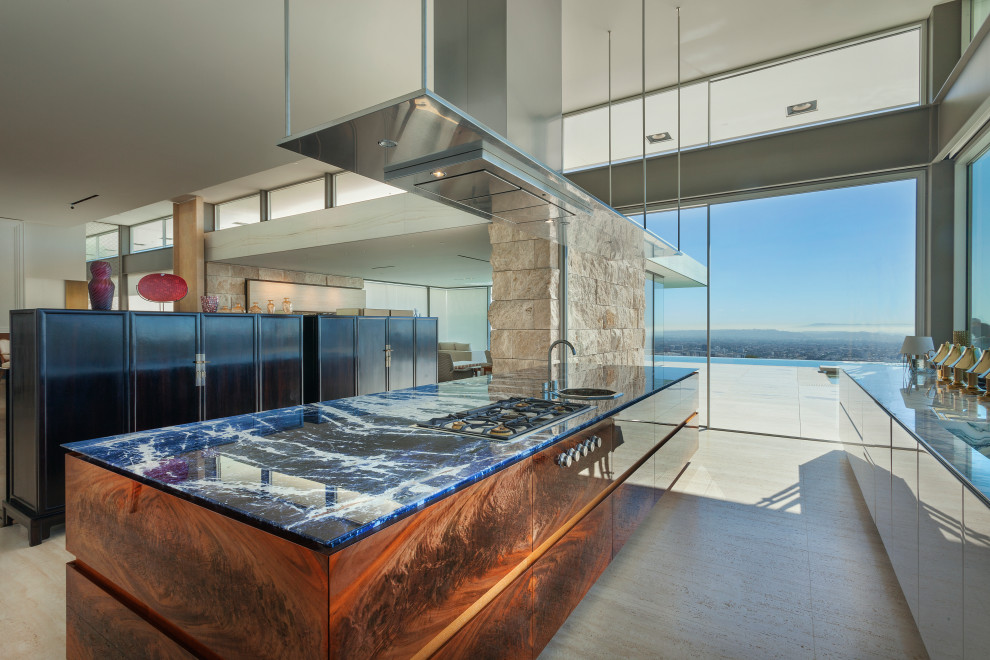 Inspiration for a modern kitchen in Los Angeles with flat-panel cabinets, marble benchtops, marble floors, beige floor and blue benchtop.