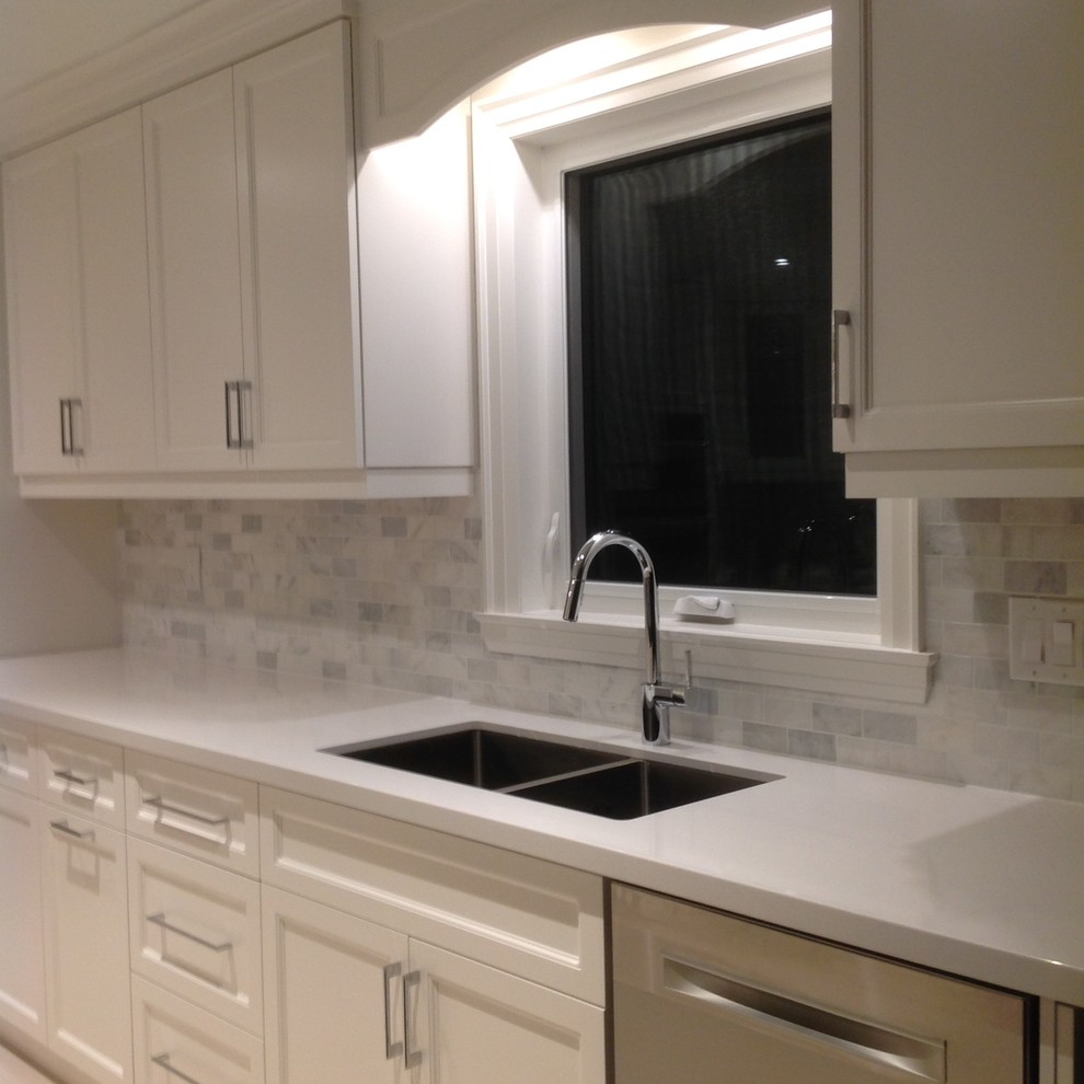 Kitchen - transitional kitchen idea in Toronto with marble backsplash