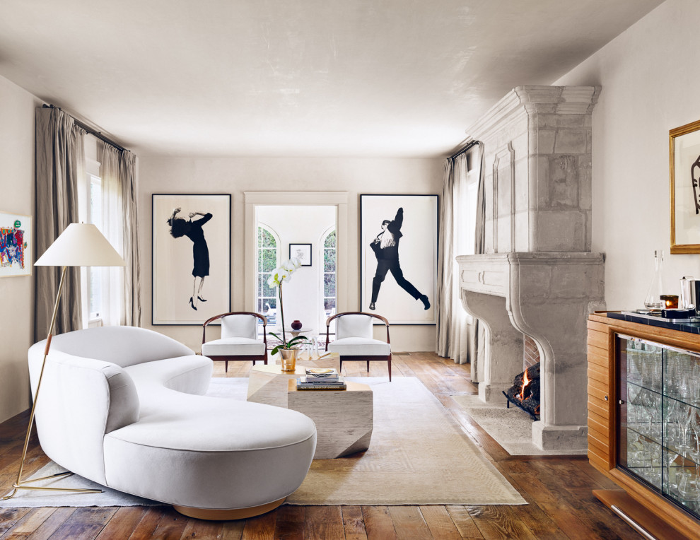 Houston Historic - Large minimalist formal and enclosed medium tone wood floor and brown floor living room photo in Houston with beige walls, a standard fireplace, a stone fireplace and no tv