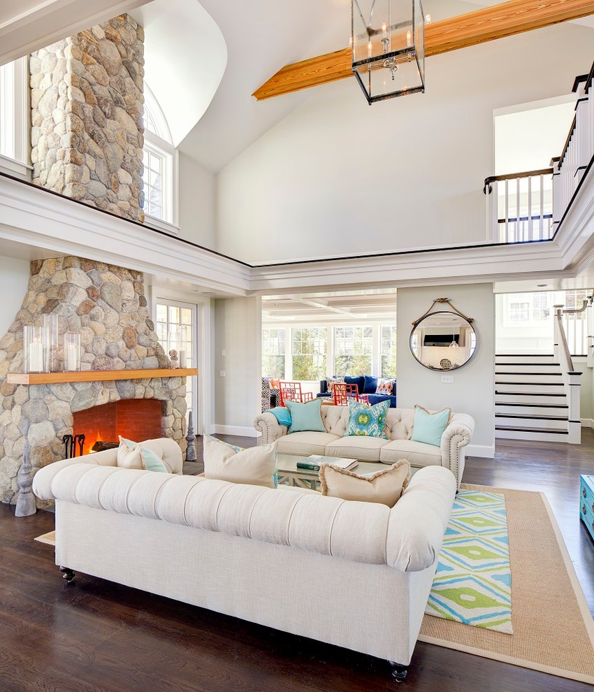 Photo of a large beach style formal open concept living room in Boston with grey walls, dark hardwood floors, a standard fireplace and a stone fireplace surround.