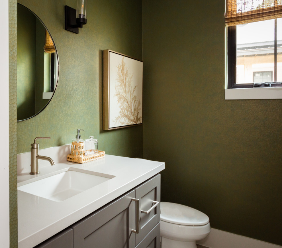 Example of a mid-sized southwest wallpaper powder room design in Houston with green walls, gray cabinets, quartz countertops, white countertops, a built-in vanity, shaker cabinets and an undermount sink