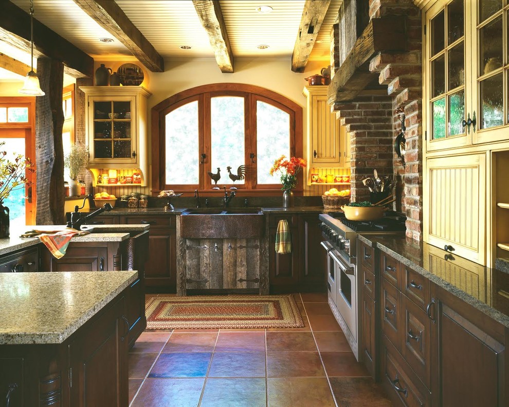 Enclosed kitchen - mid-sized rustic l-shaped terra-cotta tile and brown floor enclosed kitchen idea in DC Metro with a farmhouse sink, raised-panel cabinets, medium tone wood cabinets, granite countertops, multicolored backsplash, brick backsplash, stainless steel appliances and an island