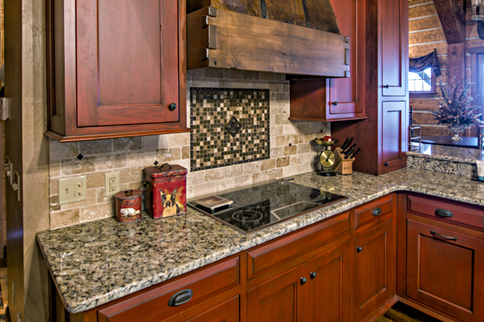 Mid-sized mountain style kitchen photo with shaker cabinets, medium tone wood cabinets, brown backsplash, stone tile backsplash and paneled appliances