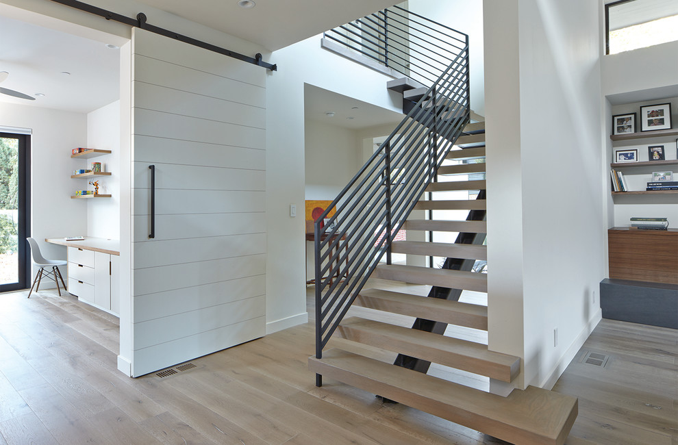 Inspiration for a large contemporary wood l-shaped staircase in San Francisco with open risers.