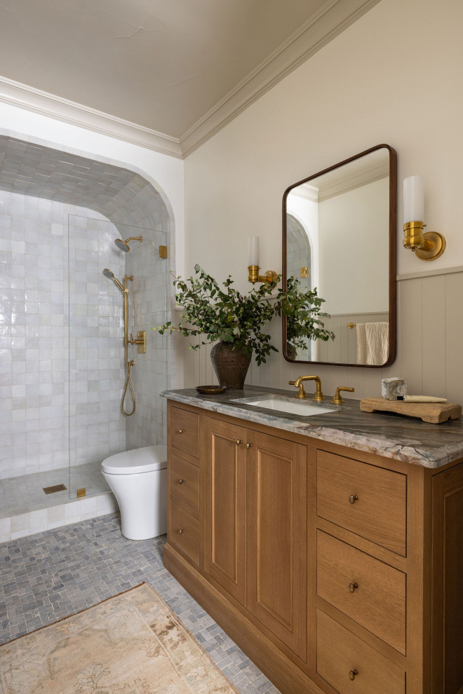 Inspiration for a transitional bathroom in Sacramento with recessed-panel cabinets, medium wood cabinets, an alcove shower, white tile, white walls, mosaic tile floors, an undermount sink, grey floor, an open shower, grey benchtops, a single vanity and a freestanding vanity.