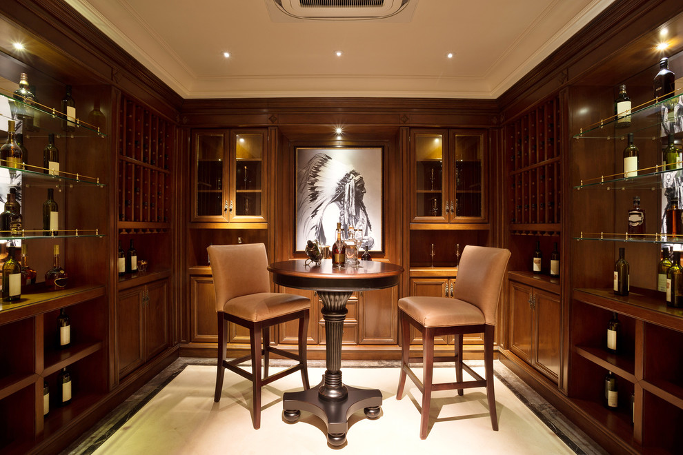 Large arts and crafts u-shaped seated home bar in Chicago with dark wood cabinets, marble floors, white floor, raised-panel cabinets, wood benchtops and mirror splashback.