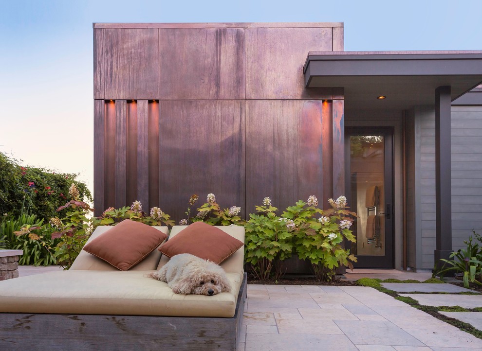 Photo of a contemporary one-storey exterior in San Francisco with metal siding and a flat roof.