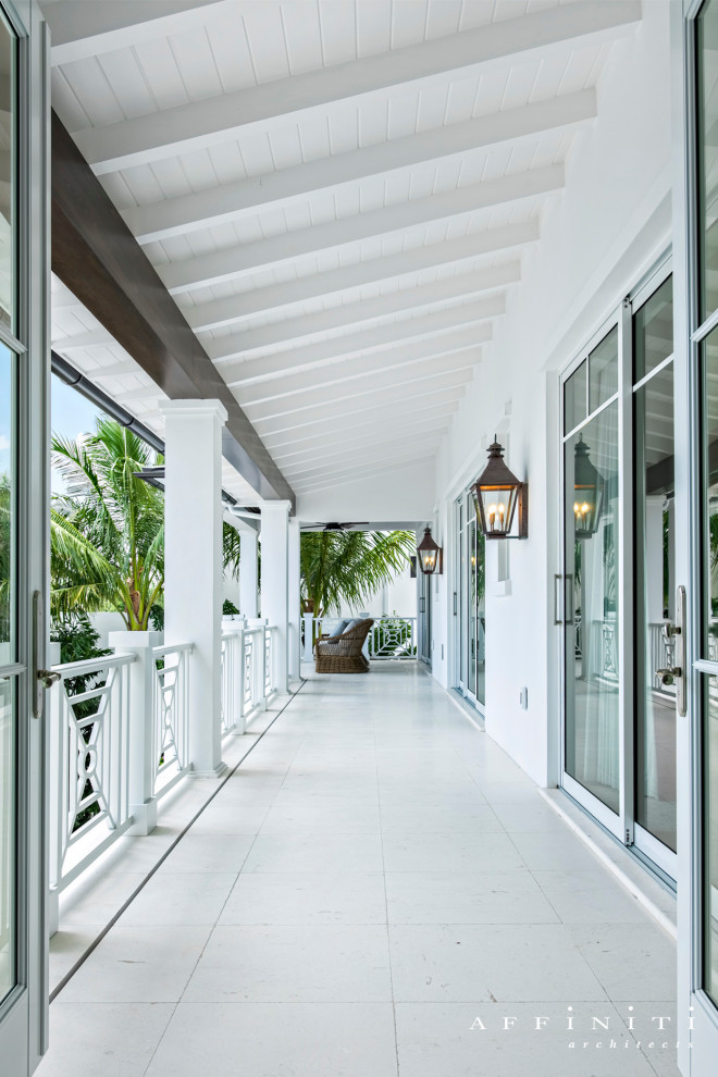 Inspiration for a tropical hallway remodel with white walls