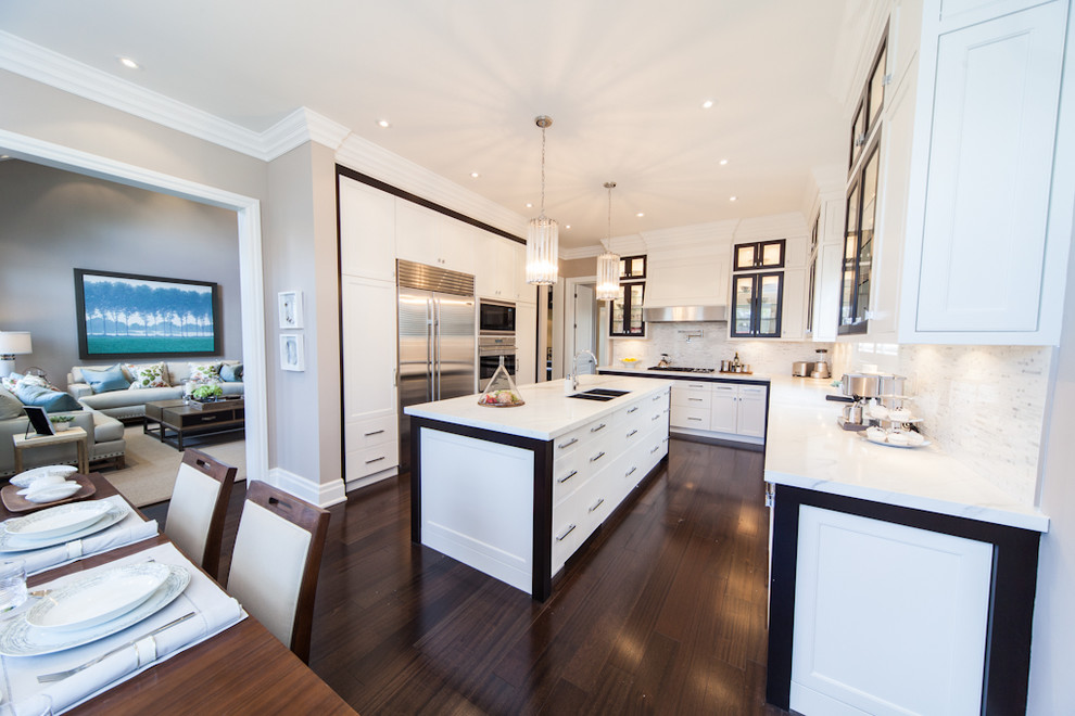 Photo of a contemporary eat-in kitchen in Toronto with glass-front cabinets and stainless steel appliances.