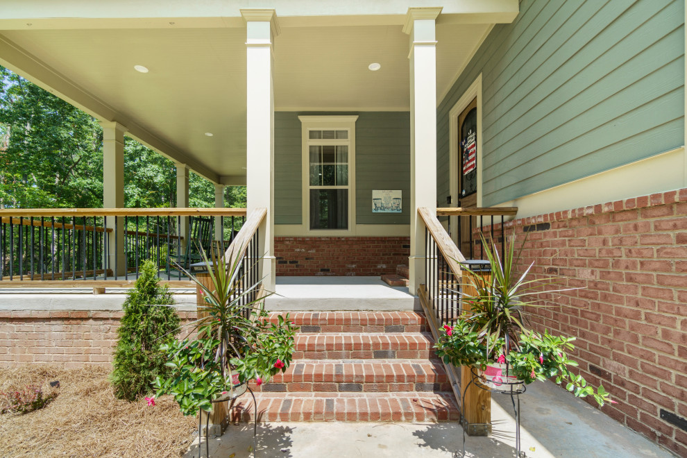 Photo of a medium sized farmhouse front door in Atlanta with a single front door and a medium wood front door.