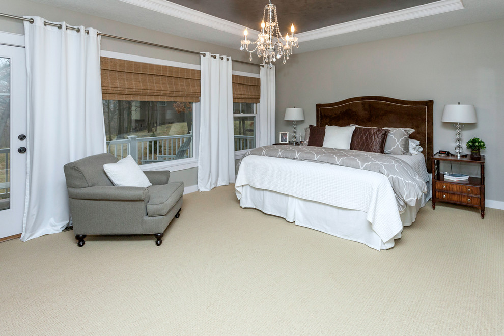 Photo of a mid-sized arts and crafts master bedroom in Other with grey walls and carpet.