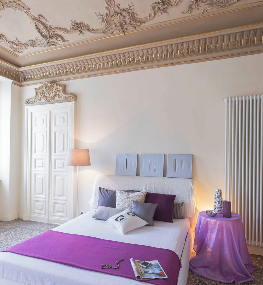 This is an example of an eclectic master bedroom in Turin with white walls.