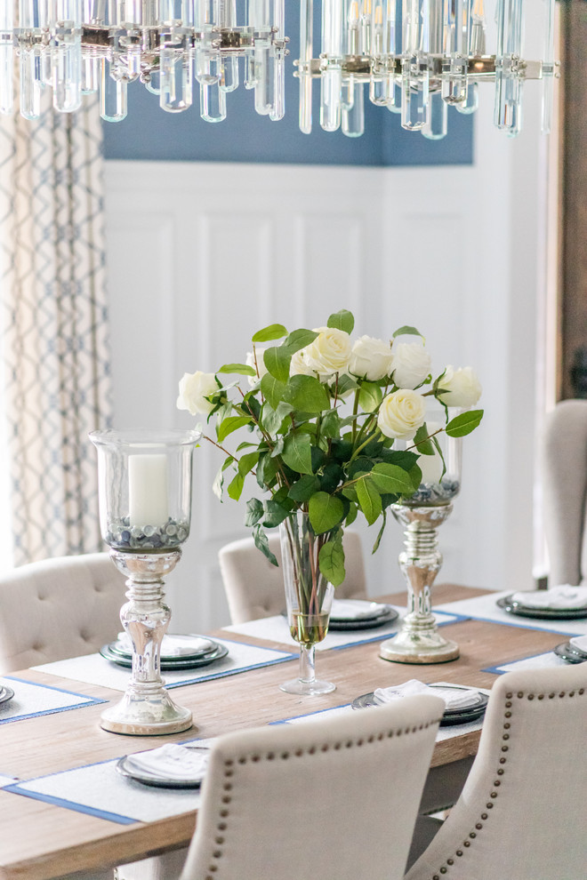 Large transitional medium tone wood floor and brown floor enclosed dining room photo in Toronto with blue walls and no fireplace