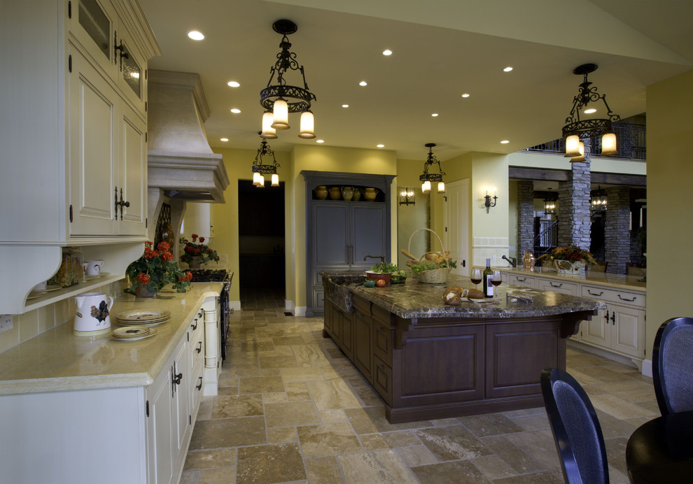 Photo of a mediterranean kitchen in Denver with solid surface benchtops.