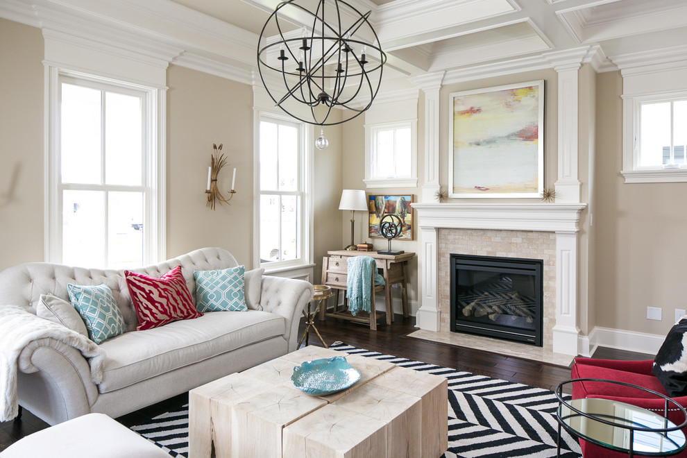 Inspiration for a transitional living room in Louisville with beige walls, dark hardwood floors and a standard fireplace.