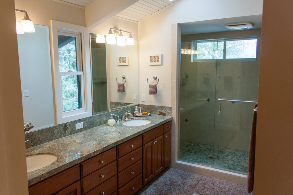 Example of a mid-sized classic master yellow tile and stone tile travertine floor double shower design in Other with an undermount sink, raised-panel cabinets, dark wood cabinets, granite countertops and white walls