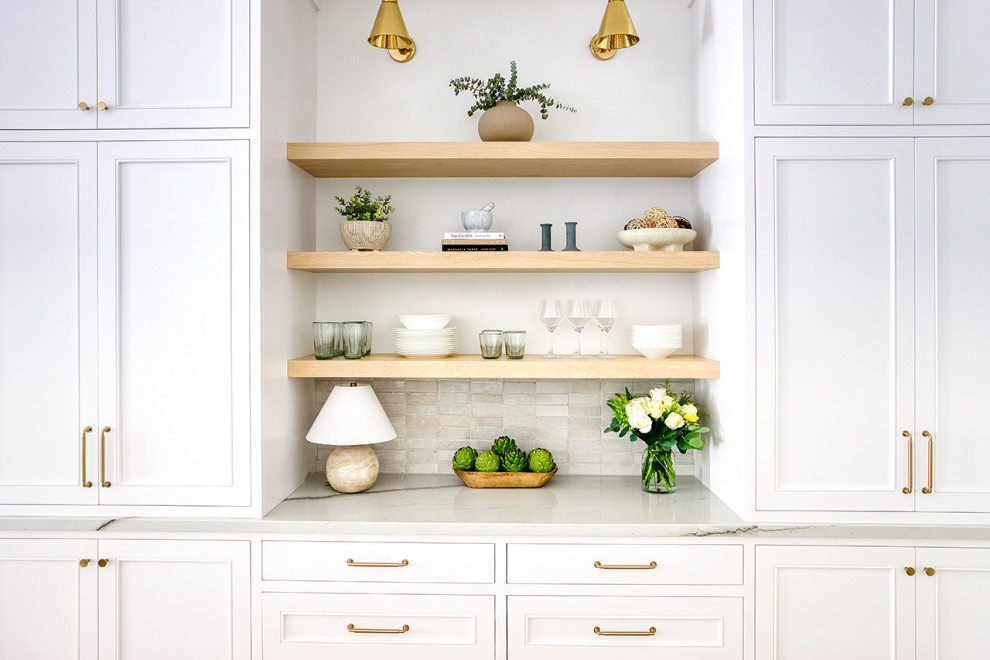 Transitional kitchen photo in Phoenix with beaded inset cabinets, white cabinets, quartzite countertops, white backsplash, stone tile backsplash and white countertops