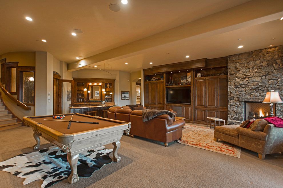 Photo of a country open concept family room in Salt Lake City with beige walls, carpet, a wall-mounted tv and beige floor.