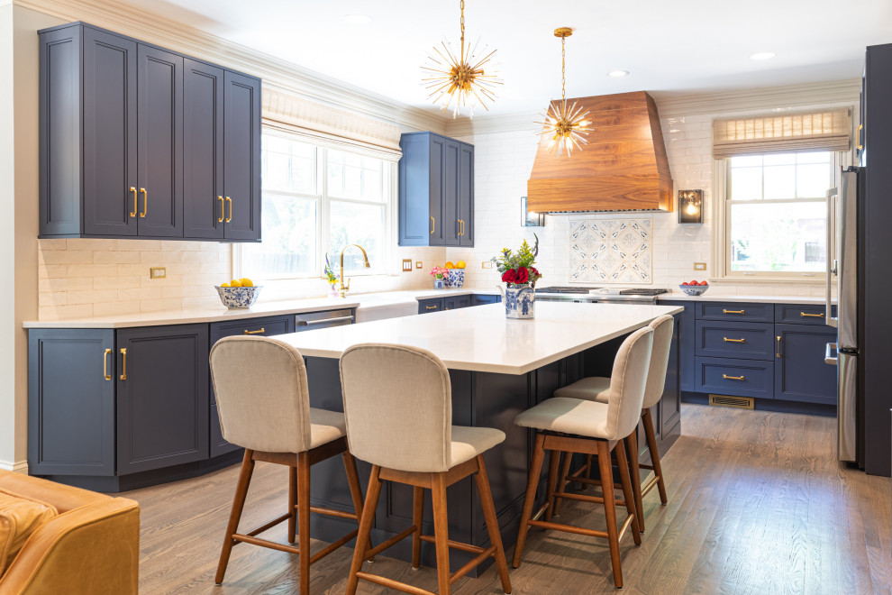 Navy & Walnut Kitchen With Gold Accents and Quartz Island