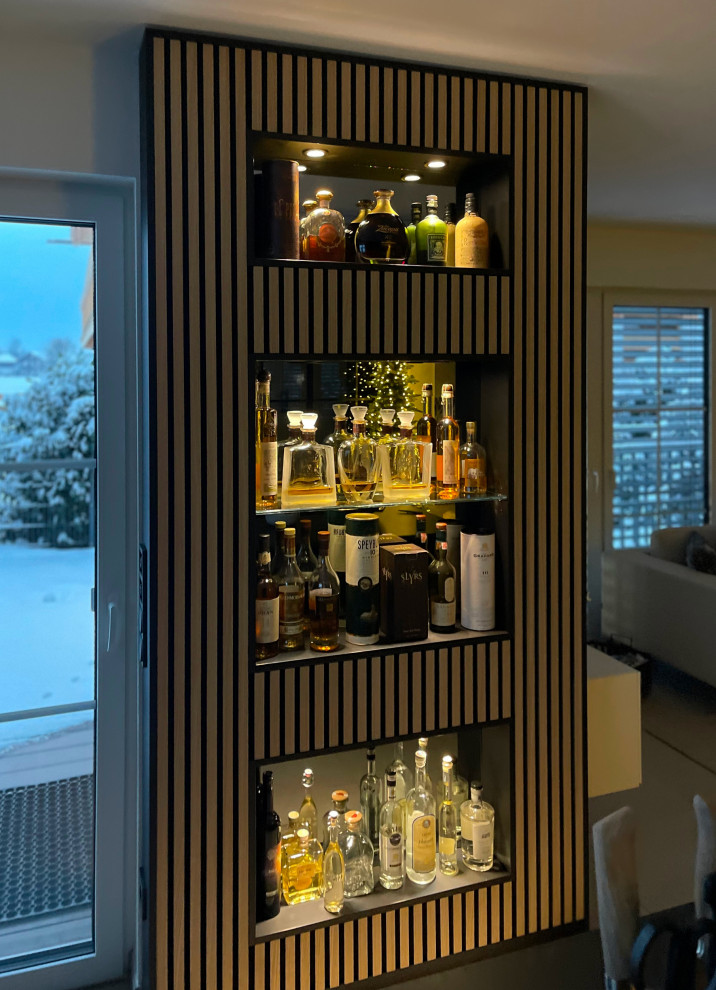 Inspiration for a small contemporary dry bar in Munich with louvered cabinets and medium wood cabinets.
