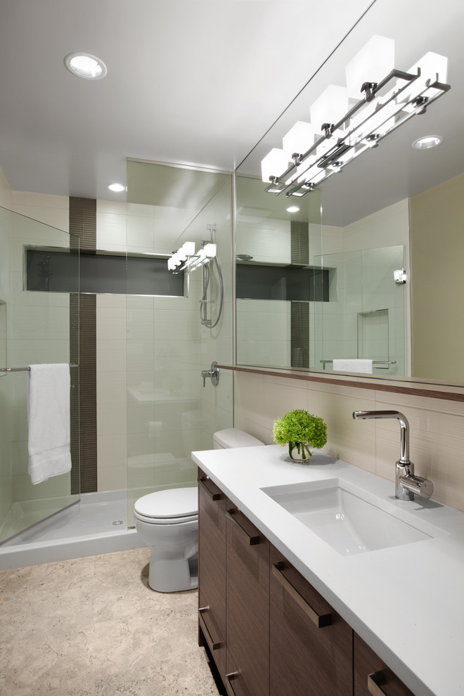 Inspiration for a large contemporary master bathroom in Vancouver with an alcove shower, flat-panel cabinets, dark wood cabinets, an undermount tub, beige tile, porcelain tile, beige walls, porcelain floors, a trough sink and engineered quartz benchtops.