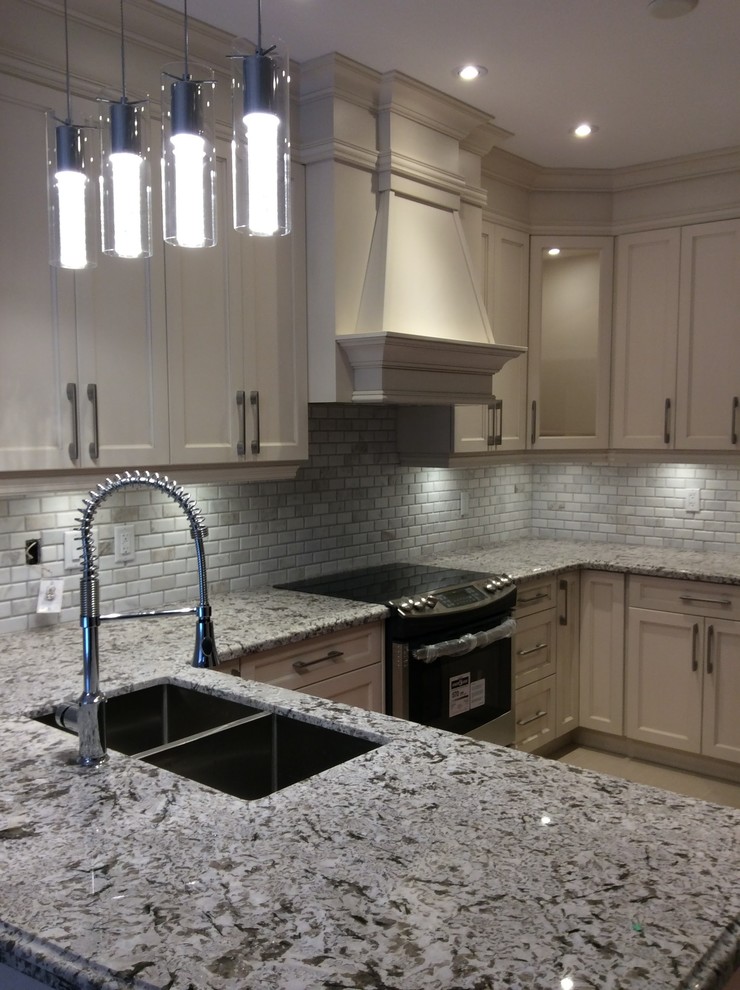 Example of a transitional kitchen design in Toronto