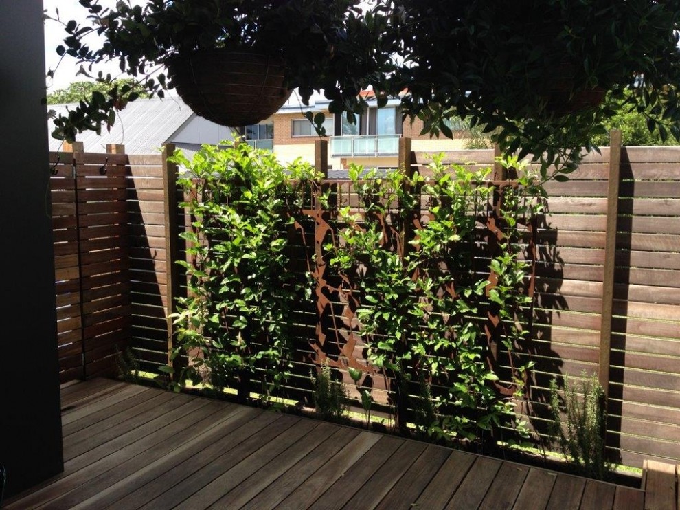 Inspiration for a small industrial courtyard shaded outdoor sport court in Brisbane with decking.