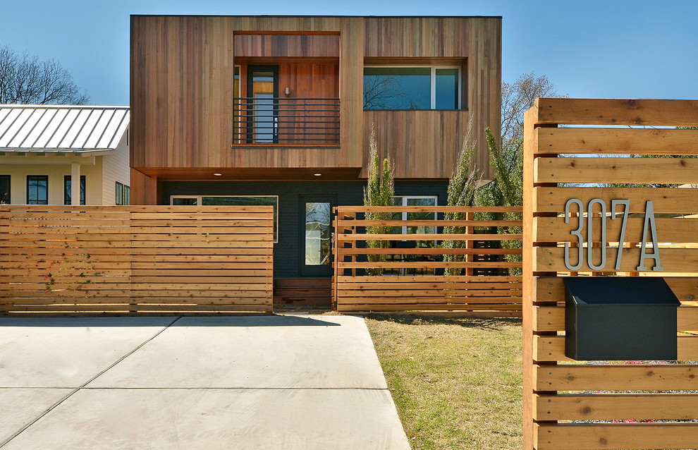 This is an example of a contemporary exterior in Austin with wood siding.