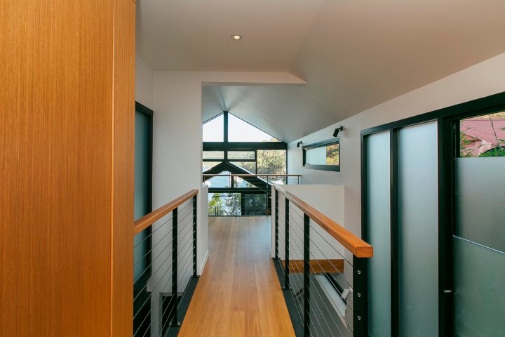 Inspiration for a small contemporary entry hall in Sydney with white walls and light hardwood floors.