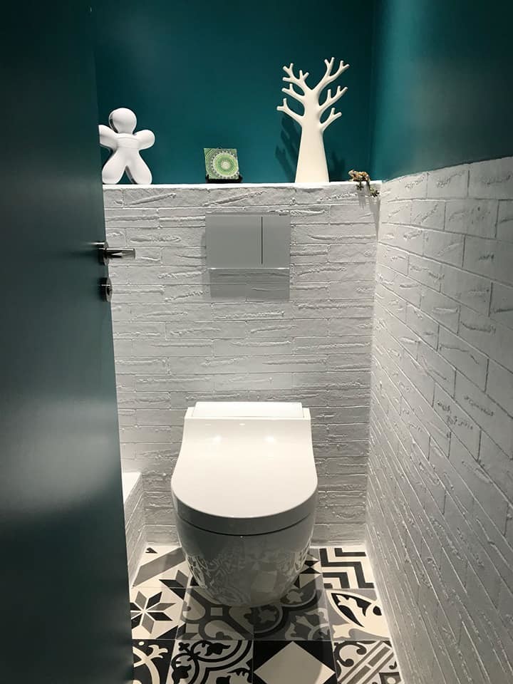 Design ideas for a small powder room in Paris with white tile, a wall-mount toilet and blue walls.