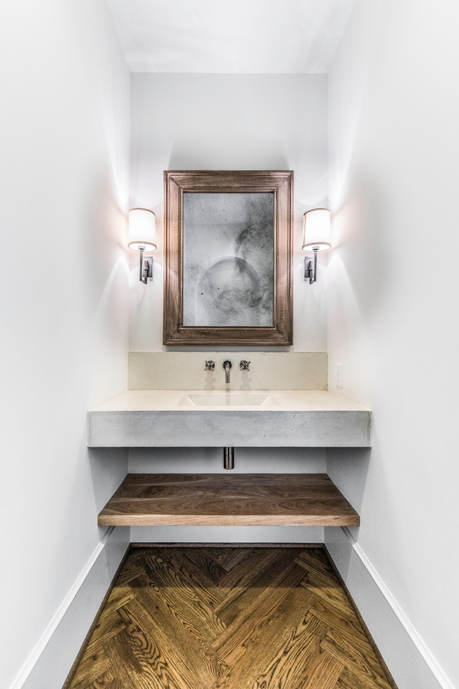 Small mediterranean 3/4 bathroom in Houston with open cabinets, dark wood cabinets, a corner tub, an open shower, a one-piece toilet, white tile, ceramic tile, white walls, medium hardwood floors, a drop-in sink, concrete benchtops, brown floor and an open shower.