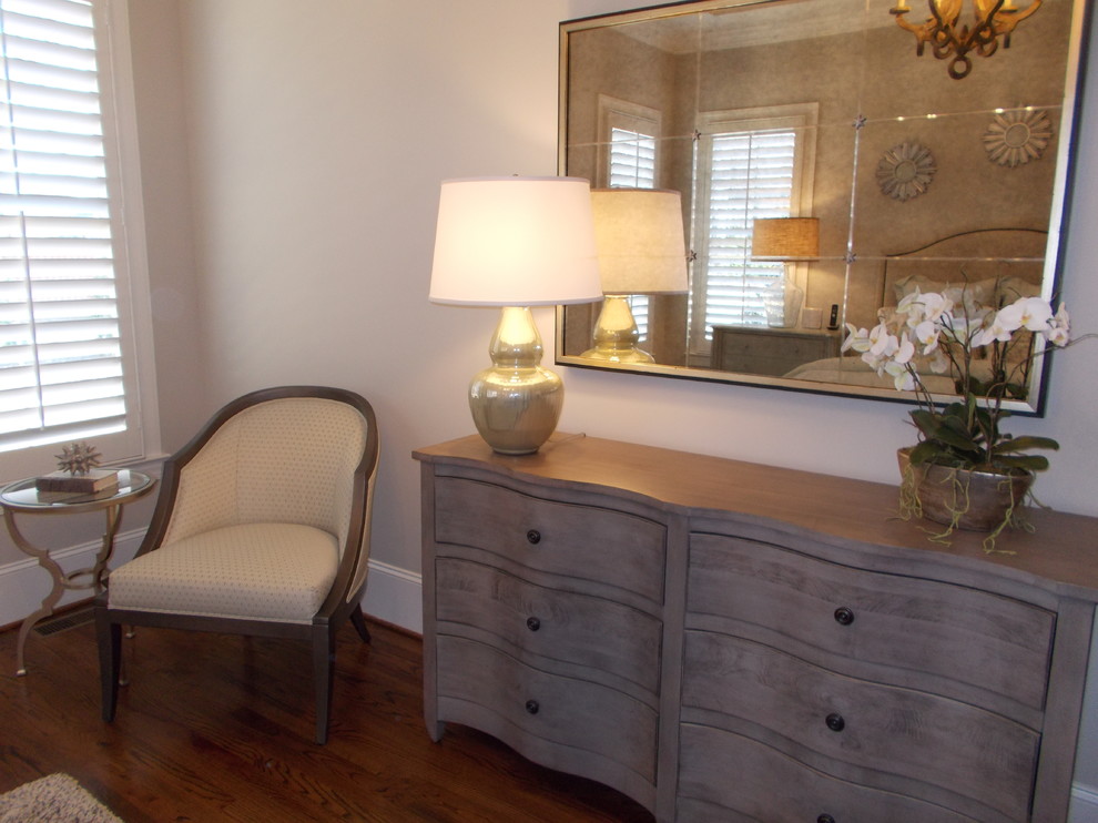 Mid-sized transitional master dark wood floor and brown floor bedroom photo with beige walls
