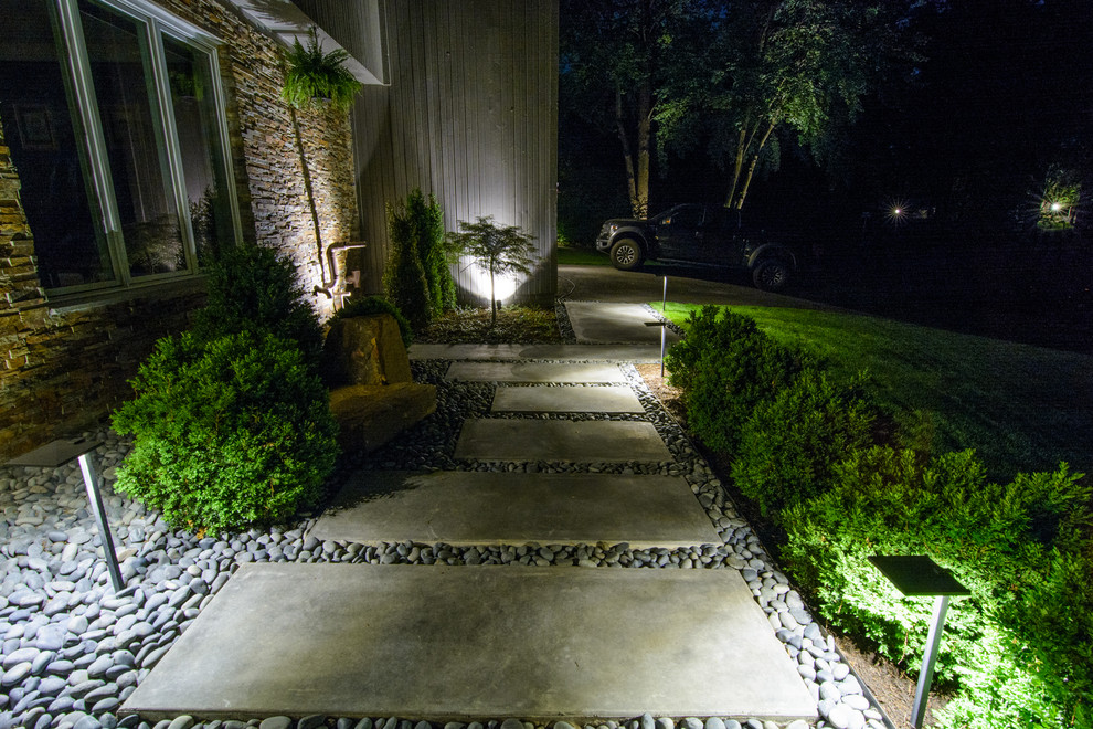 Design ideas for a large contemporary partial sun front yard concrete paver formal garden in DC Metro for spring.