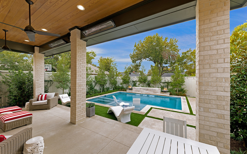 Inspiration for a transitional backyard pool in Dallas with concrete slab.