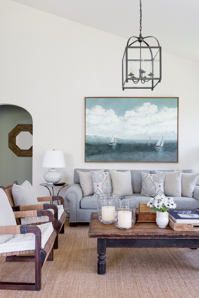 Photo of a large beach style open concept living room in New York with white walls.