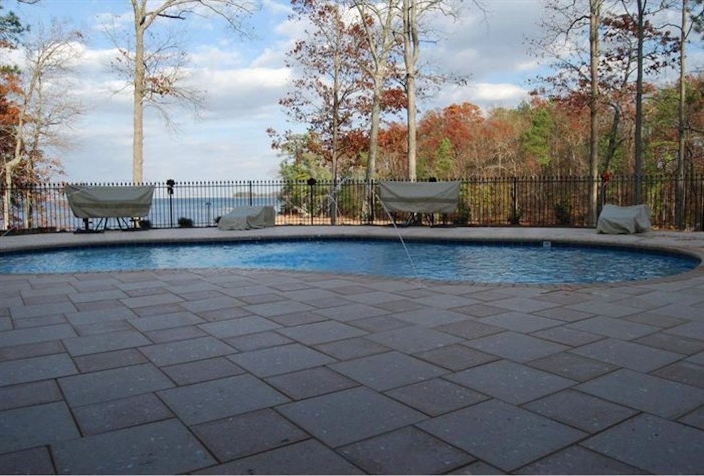 Pool fountain - mid-sized backyard stone and rectangular natural pool fountain idea