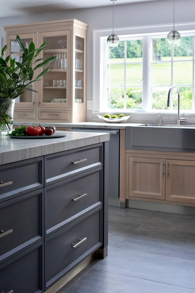 Eat-in kitchen - large transitional u-shaped porcelain tile eat-in kitchen idea in New York with a farmhouse sink, recessed-panel cabinets, light wood cabinets, quartzite countertops, gray backsplash, ceramic backsplash, paneled appliances and an island
