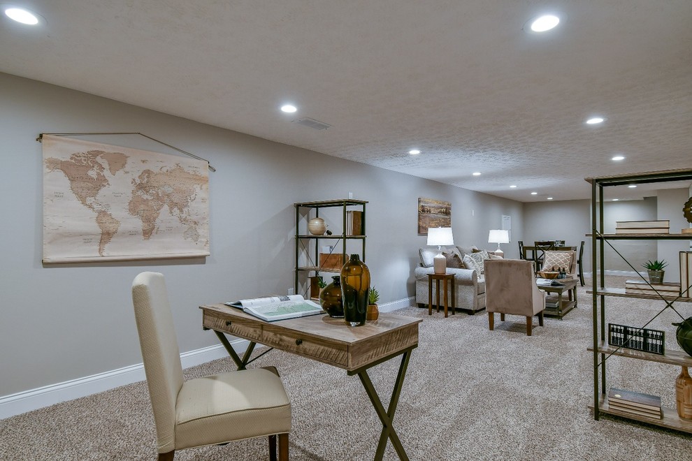 Design ideas for a large country fully buried basement in Columbus with grey walls, carpet and beige floor.